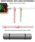 Reusable Silicone Cable Ties For Easy Cable Organization, shown in pink and green, adjustable with secure buckle for USB cables.