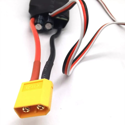 Close-up of 60A RC ESC For Drones And Planes 3S To 6S With Adjustable 5V 6V 7.4V BEC, showing XT60 lead and wires.