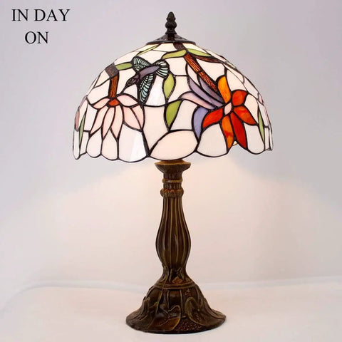 Tiffany Style Hummingbird Stained Glass Table Lamp With 12 Inch Shade And 18 Inch Tall Antique Green Bronze Base Ideal Bedside Desk Reading Light For Bedroom Living Room Home Office UL Listed With On Cord Switch, lit in day.