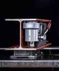 Badass Low Profile Magnetic Drill Press With Beefy 9.5 Amp Motor and Insane 2645 Pound Holding Force Cuts Clean Holes Up To 1-7/16 Inches In Metal Fabrication Jobs, side view on steel beam.