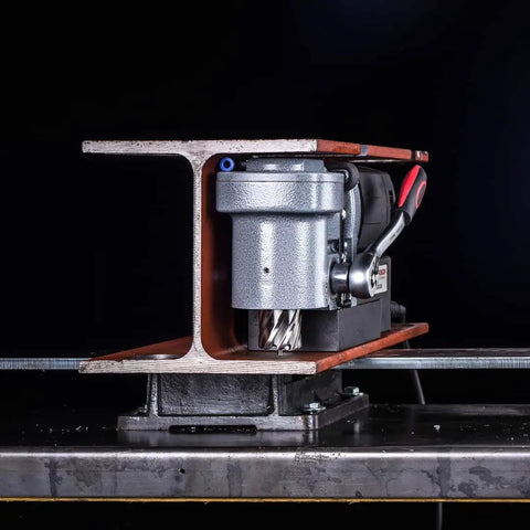 Badass Low Profile Magnetic Drill Press With Beefy 9.5 Amp Motor and Insane 2645 Pound Holding Force Cuts Clean Holes Up To 1-7/16 Inches In Metal Fabrication Jobs, side view on steel beam.