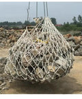 Heavy Duty Cargo Lifting Net And Industrial Hoist Sling Built Tough To Haul Freight Fast With Rock Solid Two Ton Capacity At Three By Three Meters lifting heavy rocks at a construction site.