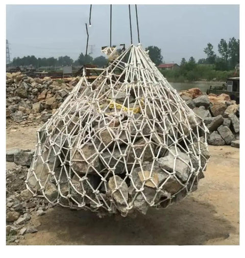 Heavy Duty Cargo Lifting Net Built For Real Work With Thick Polyester Weave for lifting a load of rocks on a construction site.