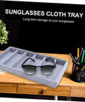 Clean Setup Six Slot Black Sunglasses Display Holder And Jewelry Organizer Box With Solid Build And Scratch Free Tray on wooden desk.