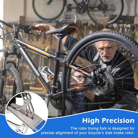 Mechanic using Rotor Truing Fork Tool For Bike Disc Alignment And Rotor Straightening No Fuss Blue Bicycle Disc Rotor Alignment Tool For MTB And Road Bikes Brake Pad And Rotor Alignment Tool on bicycle in workshop.
