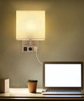 Set Of 2 Wall Sconces With USB Ports For Bedside Or Bedroom And Living Room Modern Silver Wall Lamps Easy Install With Long Cord Includes 2 E26 Bulbs Can Be Plug In Or Wall Mounted Sleek And Practical, shown above desk with cup and laptop.