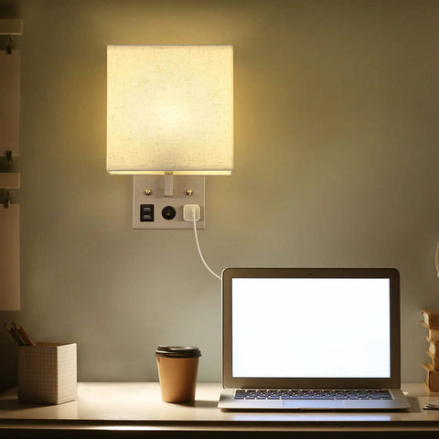 Set Of 2 Wall Sconces With USB Ports For Bedside Or Bedroom And Living Room Modern Silver Wall Lamps Easy Install With Long Cord Includes 2 E26 Bulbs Can Be Plug In Or Wall Mounted Sleek And Practical, shown above desk with cup and laptop.
