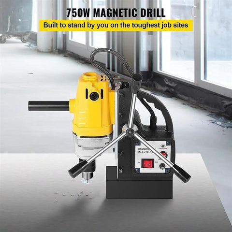 Badass 750W Magnetic Drill Press Featuring A Rocksolid 8500N Base Magnet And Slick Tabletop Build For No Sweat Core Drilling On Tough Steel Or Iron Job Site Projects on a steel surface with visible drill bits.