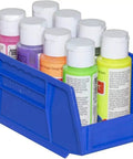 Close-up of a Blue Stackable Plastic Storage Bin 7x4x3 Inch holding small paint bottles, showcasing its durable one-piece design.