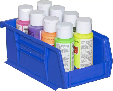 Close-up of a Blue Stackable Plastic Storage Bin 7x4x3 Inch holding small paint bottles, showcasing its durable one-piece design.