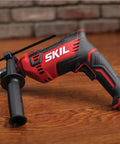 Tough As Nails Corded Hammer Drill With 100 Piece Bit Set, 7.5 Amp Variable Speed, Heavy Duty Gear For Wood Metal And Concrete, No Sweat Drilling, Pack Of 2, close-up of SKIL drill.