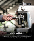54mm Bottomless Naked Portafilter For Breville 54mm Machines With Olivewood Handle Includes Double Shot Filter Basket See The Shot In Real Time And Dial In Your Espresso Like A Pro Home Barista being inserted into Breville machine.