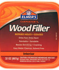Image of Elmer's Carpenter's Wood Filler, 32 oz container, labeled for interior use, features: repairs holes, gouges, fast dry, paintable and sandable.