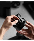 58Mm Espresso Distribution Funnel And Heavy Duty Coffee Distributor With Adjustable Bottomless Portafilter Holder held in hands.