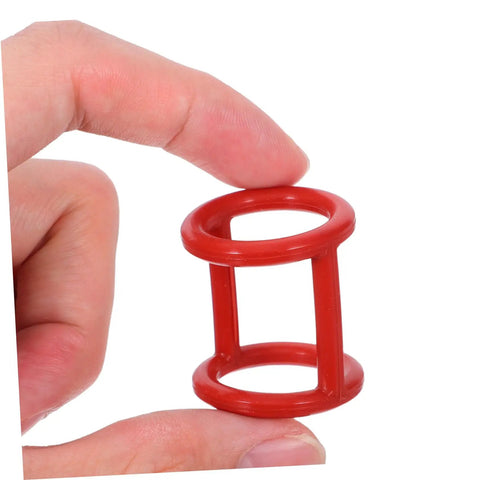 Close-up of a red silicone gasket in hand, part of the 13 Piece Silicone Seal Replacement Gaskets For Ice Cream Makers set.