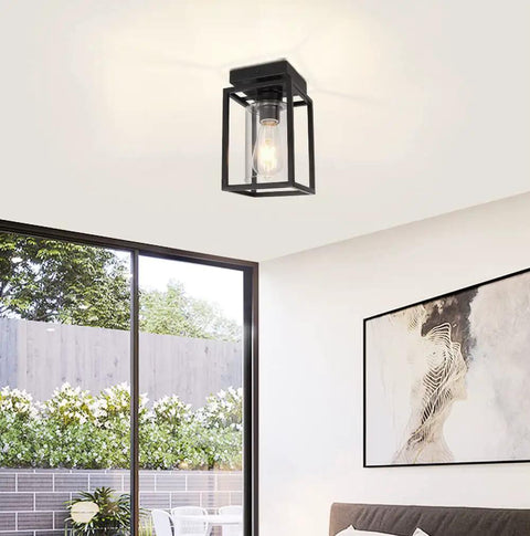 Matte Black Semi Flush Mount Ceiling Light Fixture With Clear Glass Shade Farmhouse Style in a modern living room setting