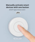 Zigbee 3 Point 0 Wireless Push Button Switch For Smart Home Scenes Two Pack Works With eWeLink App Trigger Actions By Single Tap Double Tap And Long Press white round switch being pressed by finger