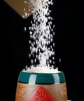Grains pouring into a Top Shelf Ceramic Rice Jar With Lid For Kitchen Pantry Organization And Dry Food Storage.