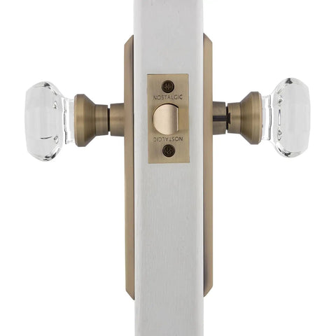 Crystal Door Knob With Long Back Plate In Waldorf And New York Style Finish For Classic Home Doors showing dual knobs on brass plate