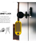 Stainless Steel Cam Lock for Cabinets and Cash Registers with Keys, shown in a cabinet door with yellow key tag.