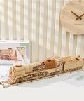 3D Wooden Steam Train Building Set For Adults With Wind Up Mechanical System displayed on a shelf with packaging