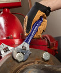 Using the Extra Wide Jaw Adjustable Wrench 8 Inch Forged Drive Tool With High Polish Chrome Finish Built For Tight Spaces One And A Half Inch Jaw Capacity to tighten a bolt.