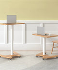Real Slick Mobile Adjustable Standing Desk With Buttery Smooth Rollaway Casters, Ergonomic Height Adjusting Computer Cart and Cozy Bedroom Side Table For Zero Fuss Home Office Flow, Straight Up Game Changer next to a chair.