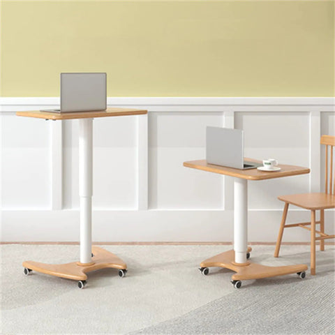 Real Slick Mobile Adjustable Standing Desk With Buttery Smooth Rollaway Casters, Ergonomic Height Adjusting Computer Cart and Cozy Bedroom Side Table For Zero Fuss Home Office Flow, Straight Up Game Changer next to a chair.