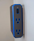 Side view of V Series Wall Power Four Outlet Surge Protector With 3000 Joules, EMI RFI Filtration, mounted on a wall, black color.