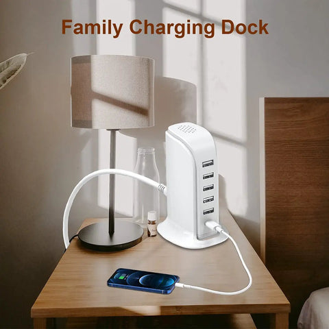 40W USB Charging Hub Workhorse With Five Ports And Type C 3A Desktop Wall Charger Tower on nightstand next to phone and lamp