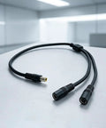 Slick Black Y Splitter Charging Extension Cable With Tangle Free Layout For Hassle Free Device Sync And Ultra Clean Cable Management Perfect For Tight Quarters Installations Plus Smart Short Throw Design Keeps Your Rig Looking Sharp, close-up view on a light background.