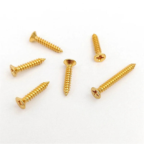 Boss Grade Pro Brass Countersunk Flat Head Phillips Self-Tapping Wood Screws M5x16, 10 Pack, scattered on white background