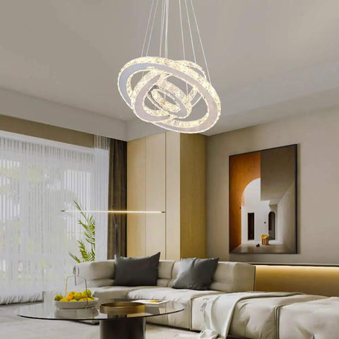Modern 3 Ring Crystal Chandelier With Adjustable Stainless Steel Pendant Lighting LED Ceiling Fixture in a living room