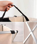 Close-up of Two Section Laundry Basket Hamper Foldable Waterproof Cloth Organizer With Aluminum X Frame and handles.