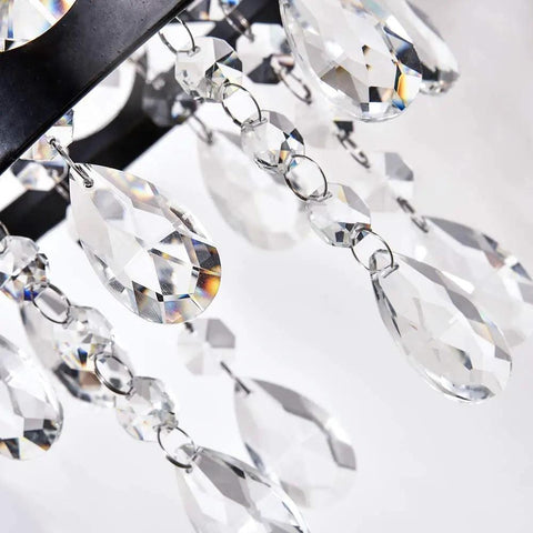Close-up of crystal droplets from Crystal Wall Sconce Set Of 2 Indoor Wall Lamps With Lattice Drum Shade For Bedroom Bedside Living Room Black Finish Durable Solid Metal Construction Slick Modern Home Decor.