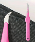 Top Shelf Heavy Duty Double Set Seam Rippers With Grippy Purple Handles For Quick Stitch Tweaks And Hassle Free Cloth Repairs Crafted Breezy For Dedicated Sewers, showcasing detailed purple handle and blade on fabric.