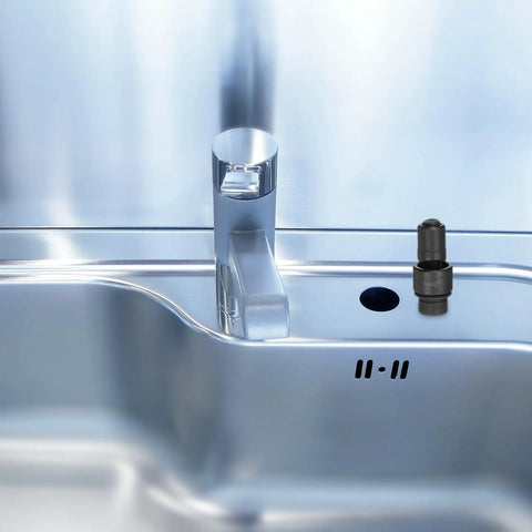 22mm Sheet Metal Punch Kit installed on a stainless steel sink, showing precise hole made by Heavy Duty Workhorse Bearing Steel Manual Knockout Punch.