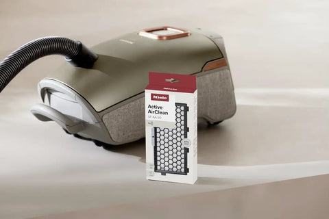 Active AirClean Filter SFAA50 for Miele Vacuum Cleaners with TimeStrip HEPA Filtration packaging next to vacuum cleaner