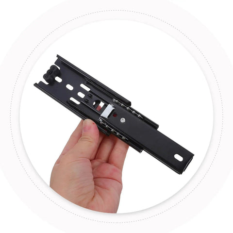 2 Pack Mini Full Extension 3 Section Ball Bearing Drawer Slides For Smooth Quiet Glide In Cabinets Dressers And Shelves Durable Metal Rails With Protective Coating Built For Daily Use. Black metal drawer slide held in hand
