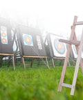Adjustable Wooden Archery Target Stand for Backyard Practice against outdoor target boards, fits recurve longbow and compound bow