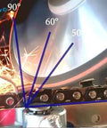 Close-up of a chainsaw blade being sharpened at various angles with sparks flying around the sharpening disk