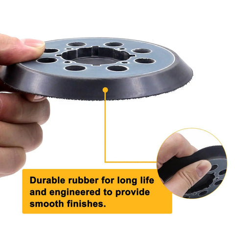 Hand holding a 4 Packs 5 Inch 8 Hole Hook And Loop Replacement Sanding Pad For DWE6423 DWE6423K DWE6421 DWE6421K DCW210B