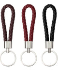 Premium Braided Pu Leather Key Fob With Solid Metal Hardware For Daily Grind Fly Woven Keychain Ring in black, red, and brown shades.