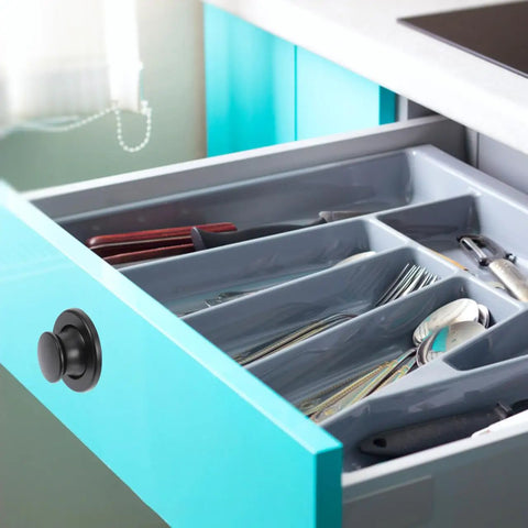 Open drawer with cutlery, featuring Six Pack Embedded Retractable Spring Knobs Zinc Alloy Cabinet Door Pulls Hidden Handle on teal cabinet