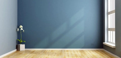 Peel And Stick Baseboard Trim With Self Adhesive Chair Rail Molding Made From Hardened Rubber installed on blue wall corner