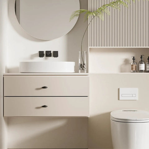 Bathroom setup with 1 Pack 2 Inch Cabinet Knob and Drawer Pull, Dope Black Zinc Alloy Cabinet Handle on beige drawers.