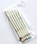 Clear pouch containing a colorful cat themed gel pens set with 0.38mm black ink, adorable cat cap tops, kawaii design for sketching.