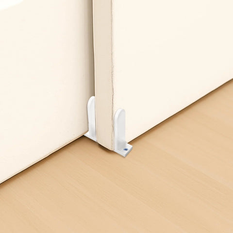 Sliding closet door with white acrylic floor guide, part of 4-Piece Sliding Closet Door Floor Guides Set In White Acrylic, Practical Bottom Guides For 1-3/8 Inch Thick Doors, Includes 8 Screws And Expansion Plugs For Smooth Sliding In Cloakrooms, Bathrooms And Kitchens, installed on light wood floor.