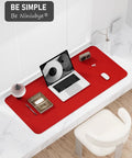 Bright Red Desk Pad 23.6 By 13.8 Inch PU Leather Non Slip Desk Mat For Laptop Mouse Keyboard Writing And Gaming Waterproof Office And Home Use Everyday Dope on desk with laptop and books.