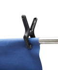 Black and grey clamp from 14 Piece Nylon Spring Clamp Set For Photography, Woodworking And Crafts holding blue fabric on rod
